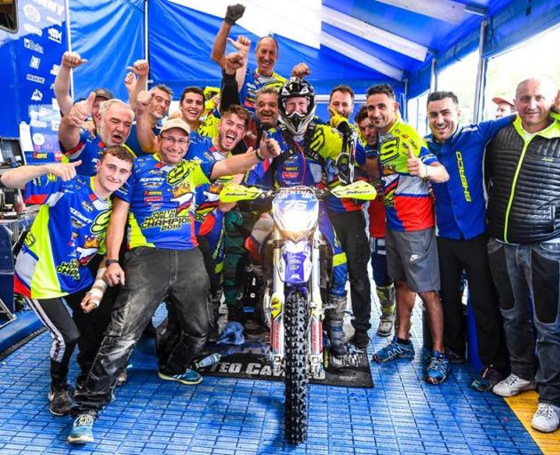 West Melton's Hamish Macdonald surrounded by family friends and team mates after his 125cc youth...