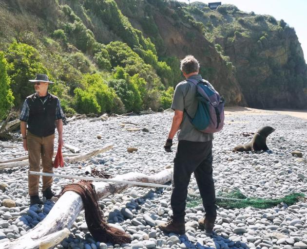 Former Department of Conservation ranger Derek Cox, of Oamaru, (left) and Doc biodiversity ranger...