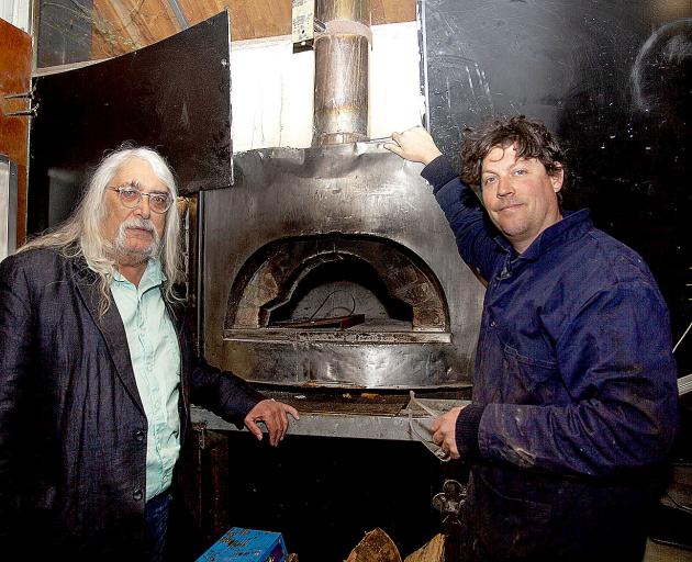 Alasdair Cassels and Joe Shanks replaced the eight-year-old wood-fired pizza oven at Cassels The Brewery Bar and Restaurant for a larger one to keep up with growing demands.  Photo: Geoff Sloan