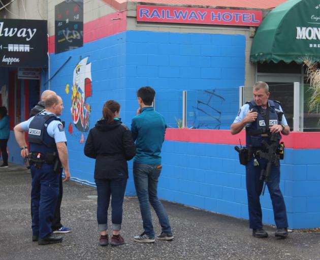 Police outside the Railway Hotel in Greymouth. Photo: Greymouth Star