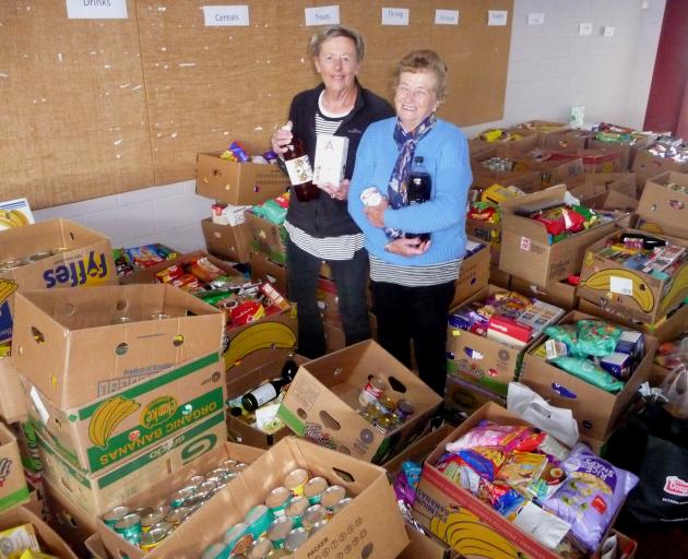 Ashburton County Lions members Janet Kingsbury and Jackie Ryan with some of the boxed items.