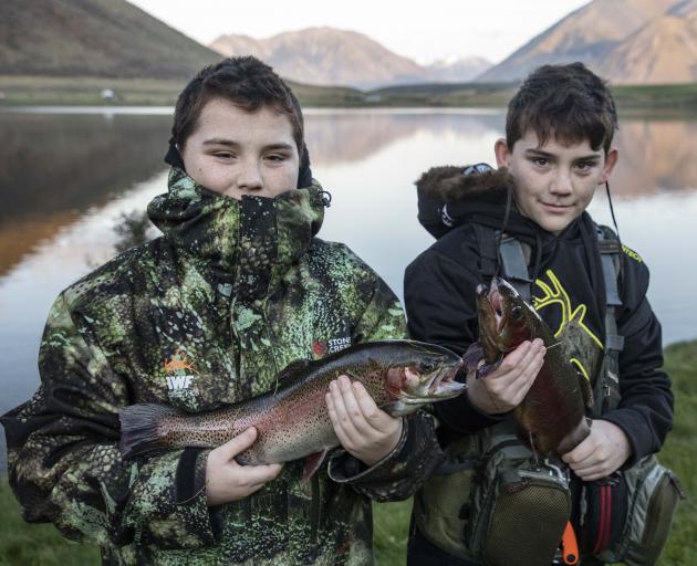 Twins Lleyton and Joshua Rogers with their catch.


