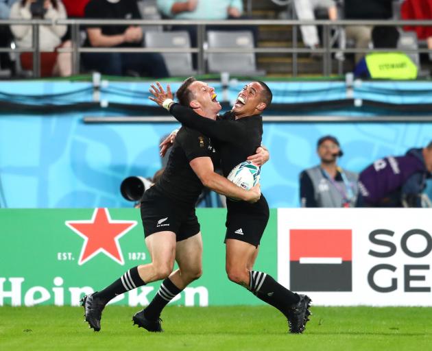 Ben and Aaron Smith celebrate Ben's second try. Photo: Getty Images 