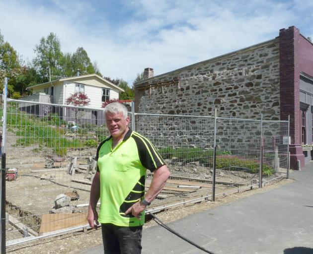 Project manager David Latta stands at the site of a controversial new building in Ross Pl,...
