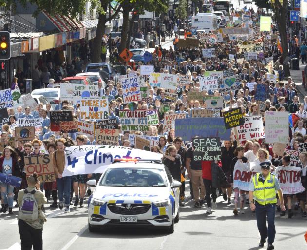 Thousands of protesters calling for action against climate change swarmed down George St in Dunedin today. Photo: Gerard O'Brien