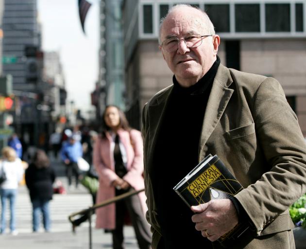 Author Clive James poses with copy of his book 'Cultural Amnesia' in New York. Photo: Reuters