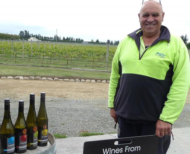 CharRees owner Charlie Hill with a selection of bottled wine made from grapes grown in Ashburton's only vineyard. File Photo