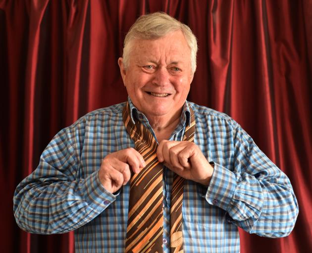 Former news reader Dougal Stevenson tries on the tie he wore for his last national news broadcast...