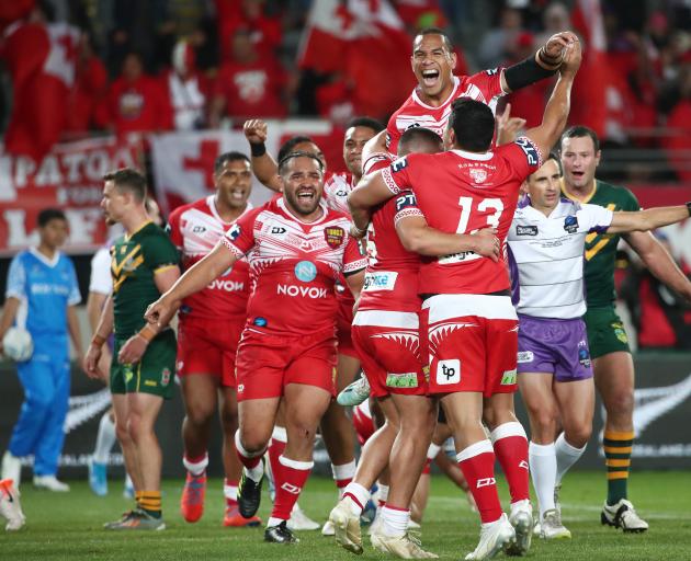 Tongan players celebrate their histoic win over Australia in Auckland. Photo: Getty Images