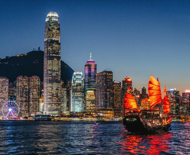 Cityscape Hong Kong and Junkboat at Twilight. Photo: Getty Images