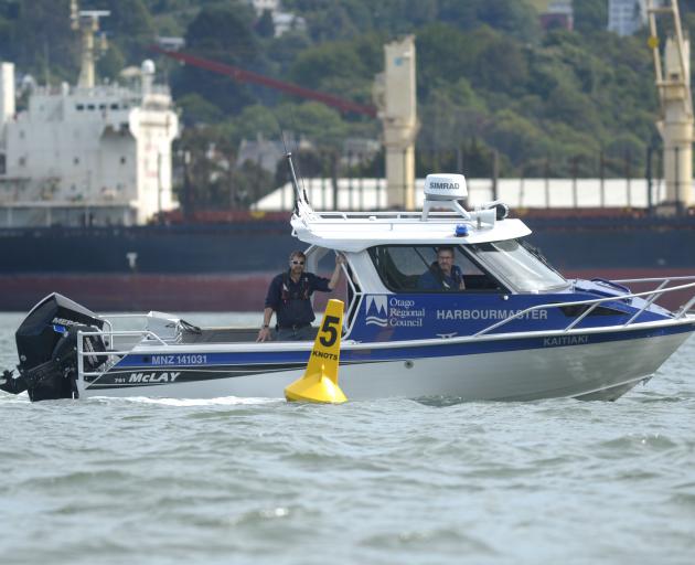 Otago Regional Council harbourmaster Steve Rushbrook (in wheelhouse) and deputy Peter Dryden...