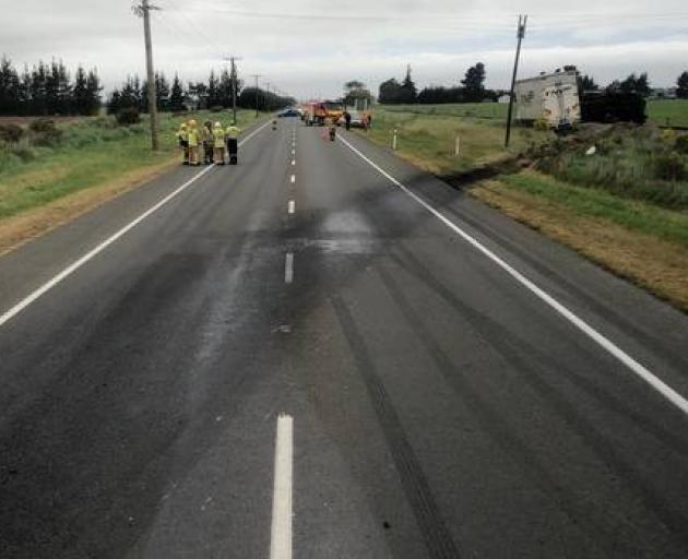 Emergency services at the scene of a serious crash involving a truck and other vehicles near...