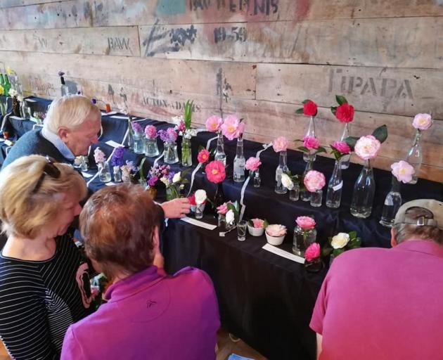 Flowers lined the walls of the Tipapa woolshed for the show. Photo: Supplied