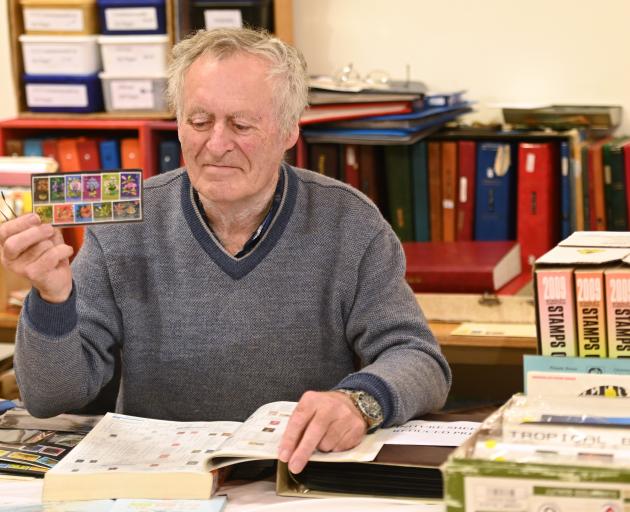 Holding a set of his favourite stamps at the stamp and postcard fair at the Dunedin Community...