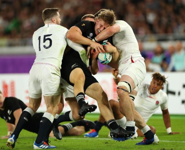 Jack Goodhue his smashed by the England defence during the All Blacks' World Cup semifinal loss....