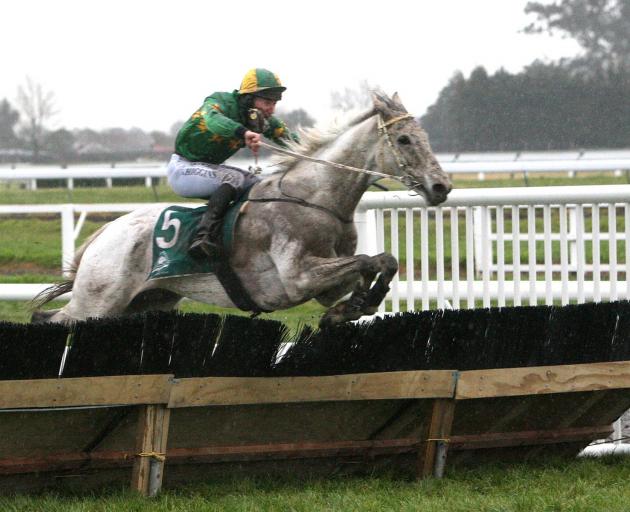 Jackfrost clears a fence on his way to winning the Grand National Hurdles at Riccarton last August. Photo: Race Images