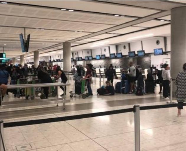 Passengers wait at Christchurch Airport at 3am on Monday after their Sydney-Auckland Jetstar...