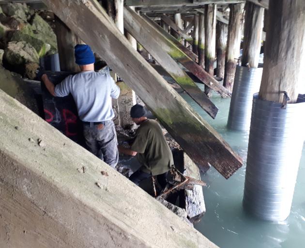 As crews worked to repair severely deteriorated wooden piles under Holmes Wharf, in Oamaru, in...