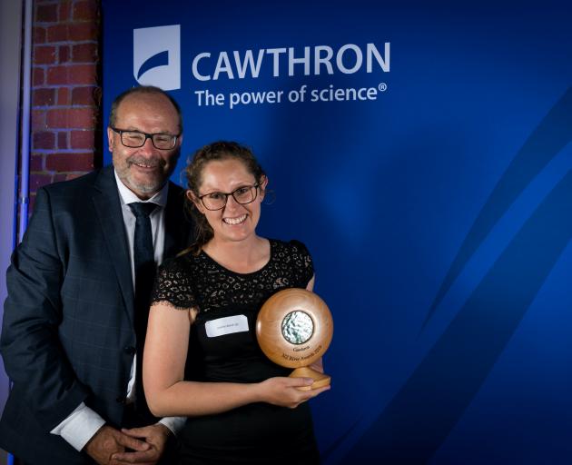 Department of Conservation director-general Lou Sanson and biodiversity ranger Jemma Welch accept...