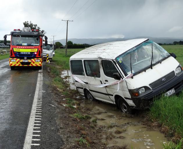 A van skidded into a ditch during a hailstorm. 