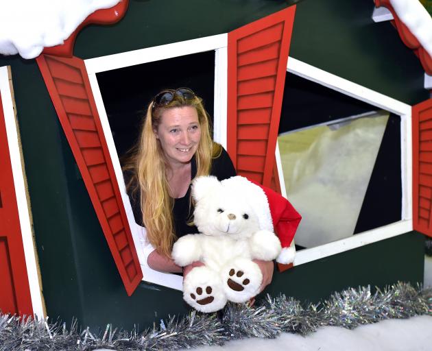 Santa Parade Trust chairwoman Michelle Ellwood in the Santa’s Workshop float, which will carry...