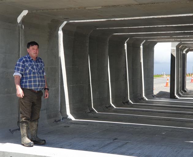 Jim MacDonald stands inside the concrete panels that are soon to be installed as a stock...