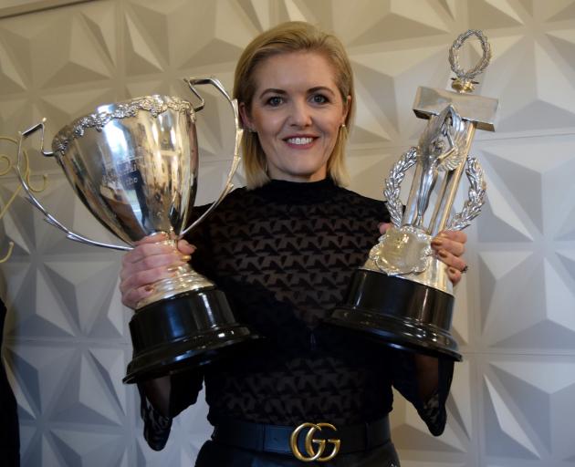 Moha Hairdressing co-owner Kylie Hayes displays two of the six trophies she won at The Industry Awards — editorial stylist of the year (left) and the Derek Elvy visionary award — in her salon in St Kilda yesterday. PHOTO: SHAWN MCAVINUE