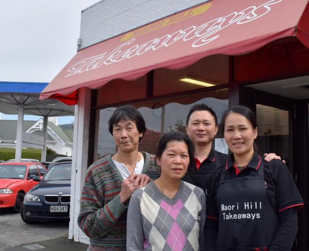 Maori Hill Takeaways former owners Chingwah (left) and Alice Cheung (second from left) and new owners Jimmy Huang and Cindy Zhu. PHOTO: SHAWN MCAVINUE Maori Hill Takeaways former owners Chingwah (left) and Alice Cheung (second from left) and new owners Jimmy Huang and Cindy Zhu. PHOTO: SHAWN MCAVINUE