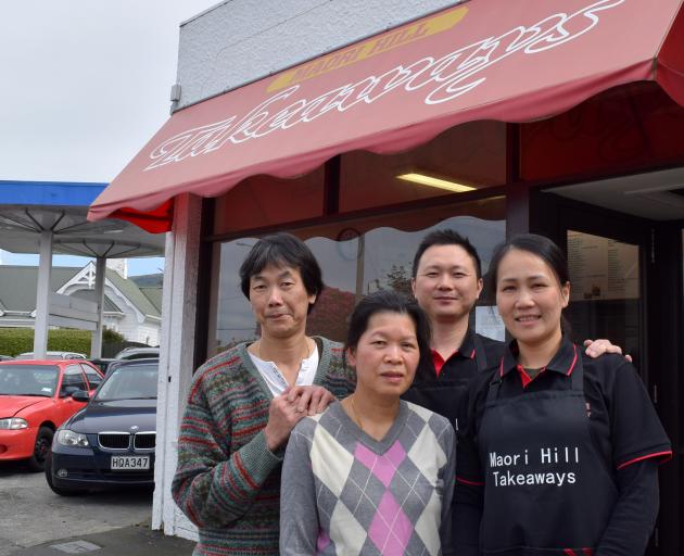 Maori Hill Takeaways former owners Chingwah (left) and Alice Cheung (second from left) and new owners Jimmy Huang and Cindy Zhu. PHOTO: SHAWN MCAVINUE