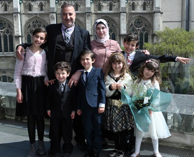 Mouhannad Taha and Lina Alhaj Shahin with their children (from left) Zenah (12), Ahmad (4), Faek (8) Noor (9), Mouhammad Ali (11) and Heba Taha (6) after a citizenship ceremony, in Dunedin yesterday. Photo: Linda Robertson