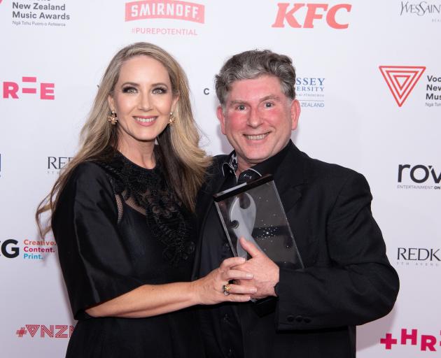 Carmel Walsh, wife of Simon O’Neill, and Professor Terence Dennis hold the award for best...