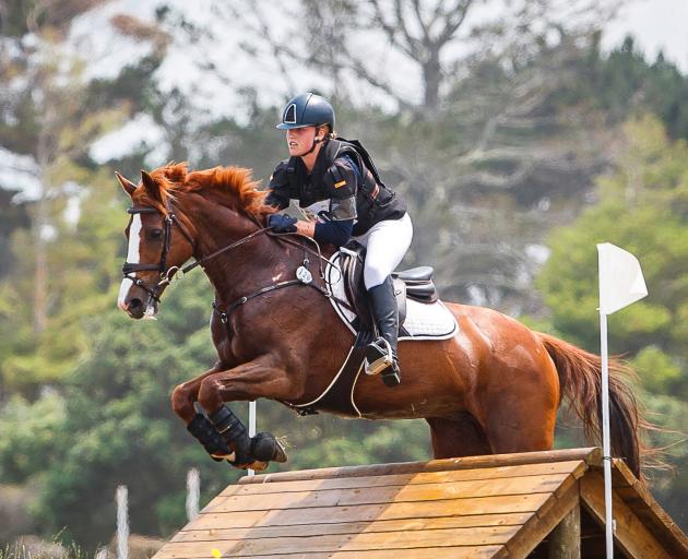 Ella Morshuis and her horse World Famous clear a cross-country obstacle at the Puhinui three-day...