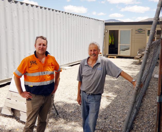 Luke Win (left) of R&R Hiab Services and Cromwell Menz Shed spokesman Dennis Booth discuss the latest developments taking shape at the Menz Shed base, which is now at the Cromwell Racecourse. Photo: Alexia Johnston
