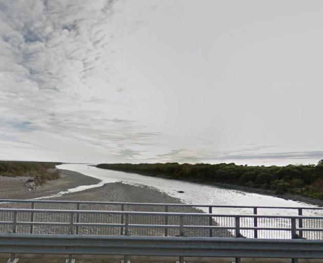 A view of the Arahura River, looking out to sea from the bridge on State Highway 6 north of...