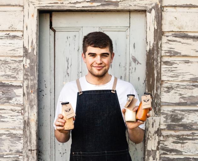 Burger Plant founder and chef Thomas White shows some of his vegan sauces. PHOTO: SUPPLIED