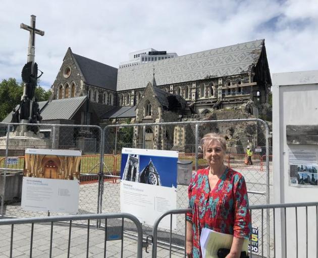 Anna Crighton outside  the Christ Church Cathedral behind her. Photo: RNZ / Sharon Brettkelly