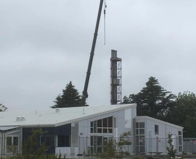 The boiler house chimney at the old Hornby High School site is being demolished. Photo: Supplied