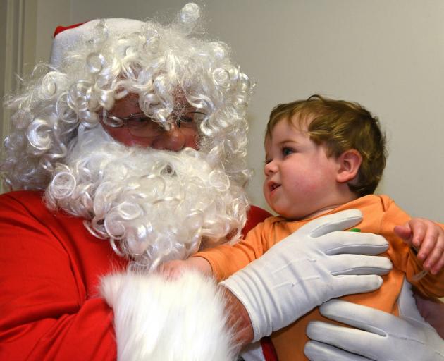 Cooper McCook is in awe at meeting Santa Claus at the Dunedin Hospital children’s ward yesterday....