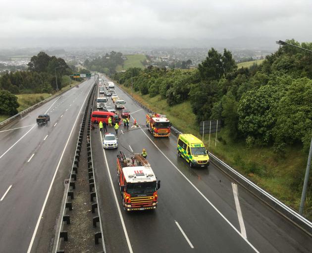 Traffic is backed up after a crash between a van and a logging truck on Dunedin's Southern...