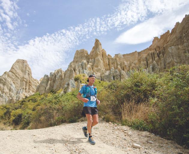 Eric Ross jogs past the Clay Cliffs in the Alps 2 Ocean Ultra earlier this year. Photo: Supplied