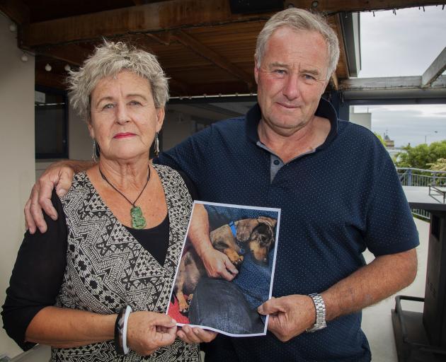 Jane Abbott and her husband Bill hold a picture of Alfie, who was mauled and killed by two dogs...