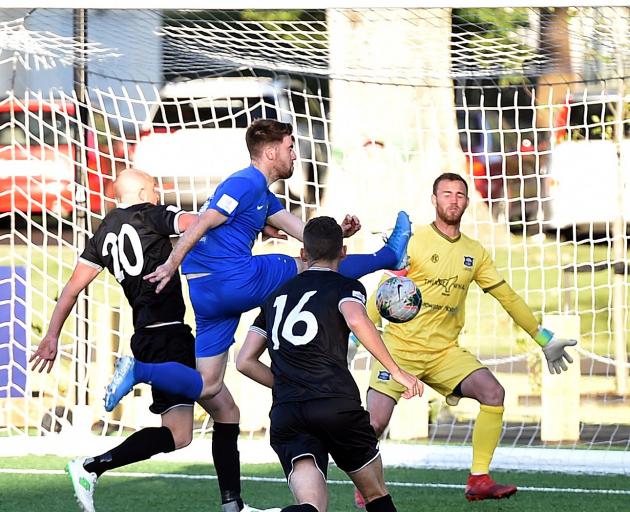 Garghan Coughlan scores for Southern United as Hawke's Bay United players (from left) Bill...