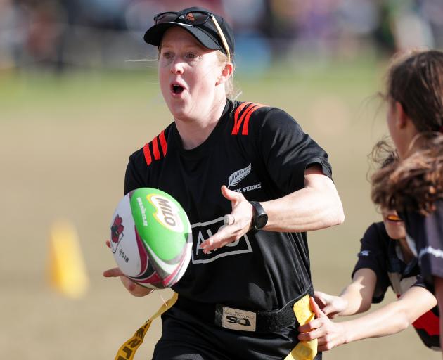 Black Ferns halfback Kendra Cocksedge moves the ball in an invitational tournament involving...