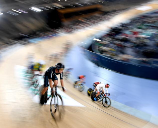 Aaron Gate, of New Zealand, on his way to winning the final of the men’s omnium at the UCI Track...