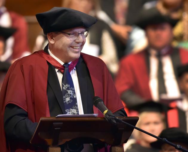 Prof John Reynolds speaks to graduates at the Dunedin Town Hall.