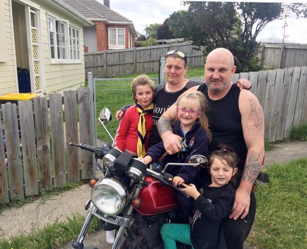 Tania Young (36) and Neil Ross (36) with three of their four children (from left) Jamiccia (9),...