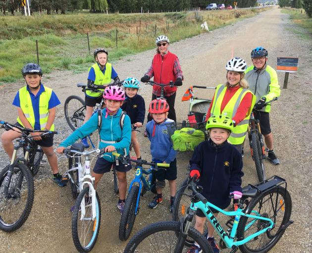 Cycling the  Otago Central Rail Trail, on their way to have their petition heard at yesterday’s Central Otago District  Council meeting are (clockwise, from left) Zavier Robb (12) Julius Gorman (12), Anika Robb (8), Lynn Stewart, Doug White, Elina Kiuru, 
