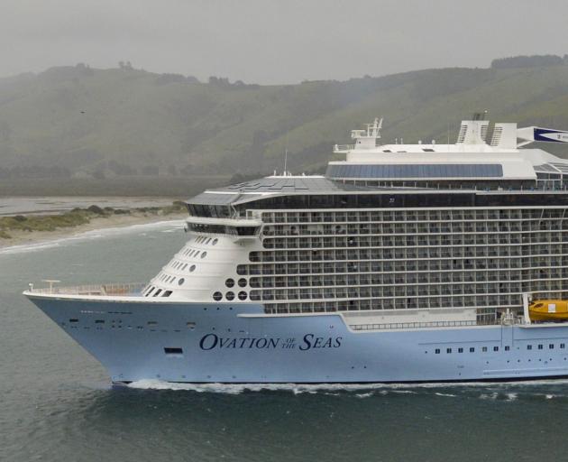 Ovation of the Seas sails through wind and rain into Otago Harbour yesterday morning. Photo by Gerard O'Brien.