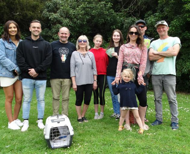 Handing over their Christmas money to Dunedin Wildlife Hospital Trust chairman Steve Walker
...