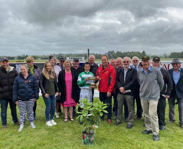 Tapanui Racing officials join the connections of Kilowatt for the presentation of the Tapanui Cup...
